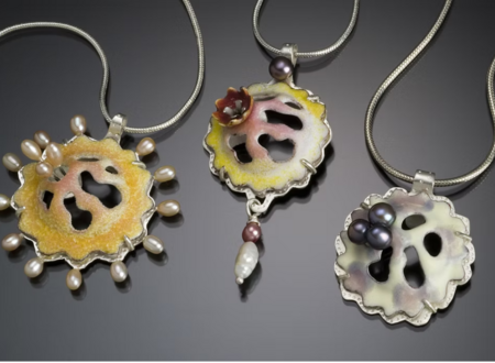 Three pendants by Kathryn Osgood made with vitreous enamels and die forming techniques.