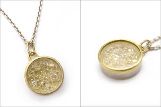 Acebo.gold and silver captured quartz pendant